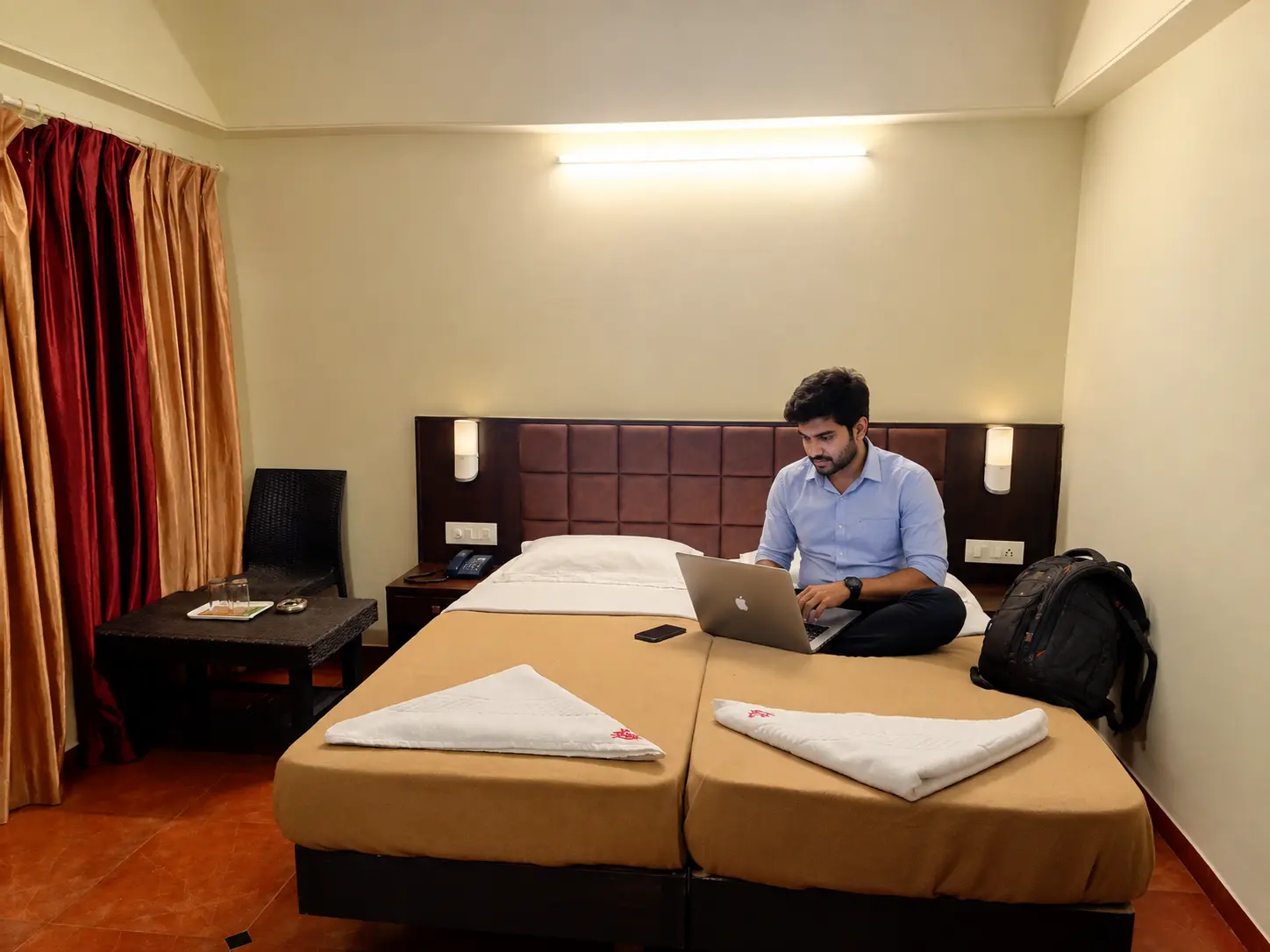 Compact room with two single beds at Hotel Viva Baga in Goa